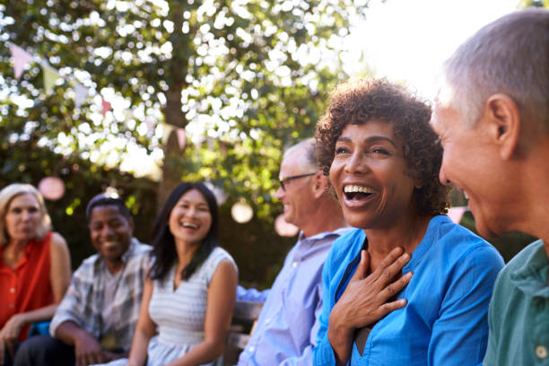 A joyful group of friends laughing outdoors