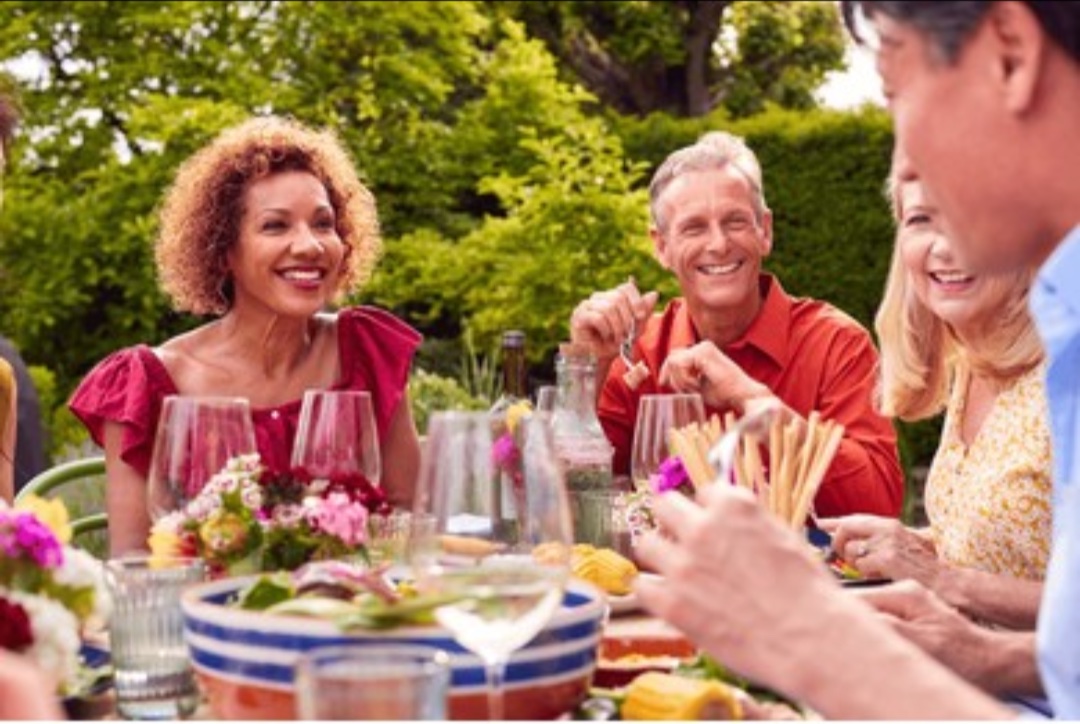 Friends connecting over an outdoor dinner
