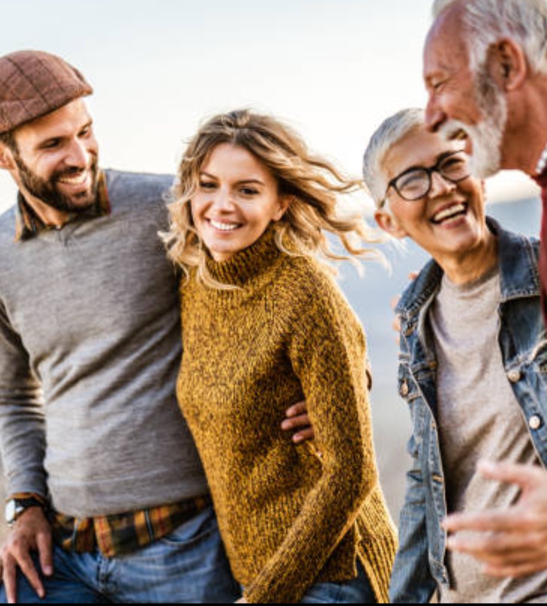 Friends of different ages laughing together